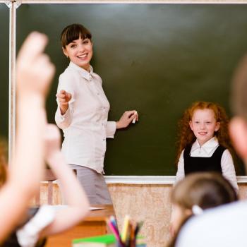 women teaching children