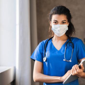 Health care assistant with mask on