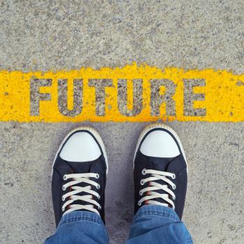 image of feet standing on a yellow line reading "future"