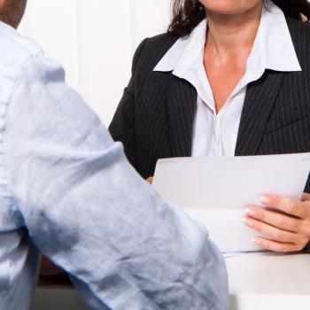 settlement worker and client talking